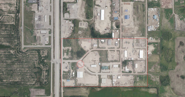 Picture1 Aerial map of an industrial area in the Town of Valleyview with a red outline marking the affected zone near 36th Avenue. A smaller red circle highlights the suspected location of a water main leak along a curved roadway within the outlined area. Surrounding buildings, roads, and open land are visible for context.